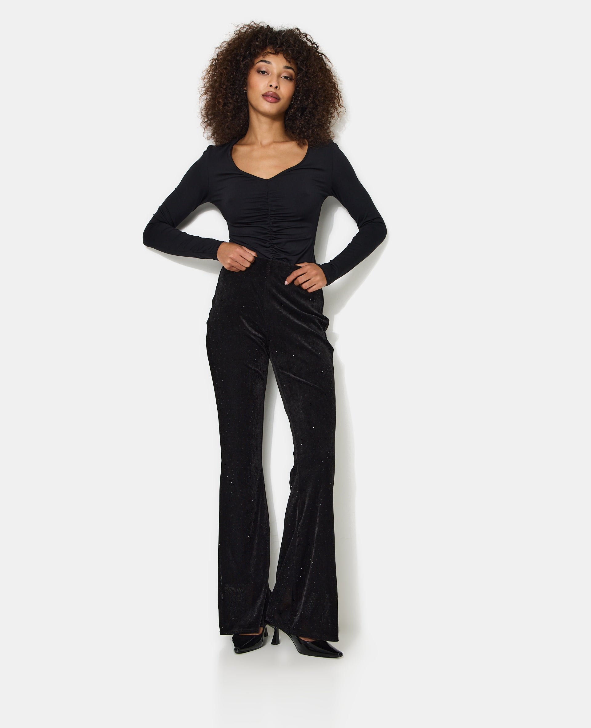 Pantalon flare en résille et velours avec strass