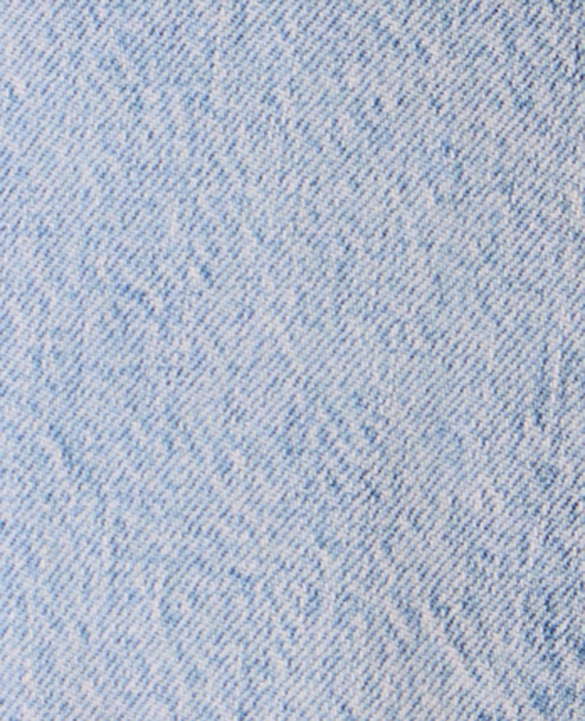 Jean flare taille basse avec détails coutures