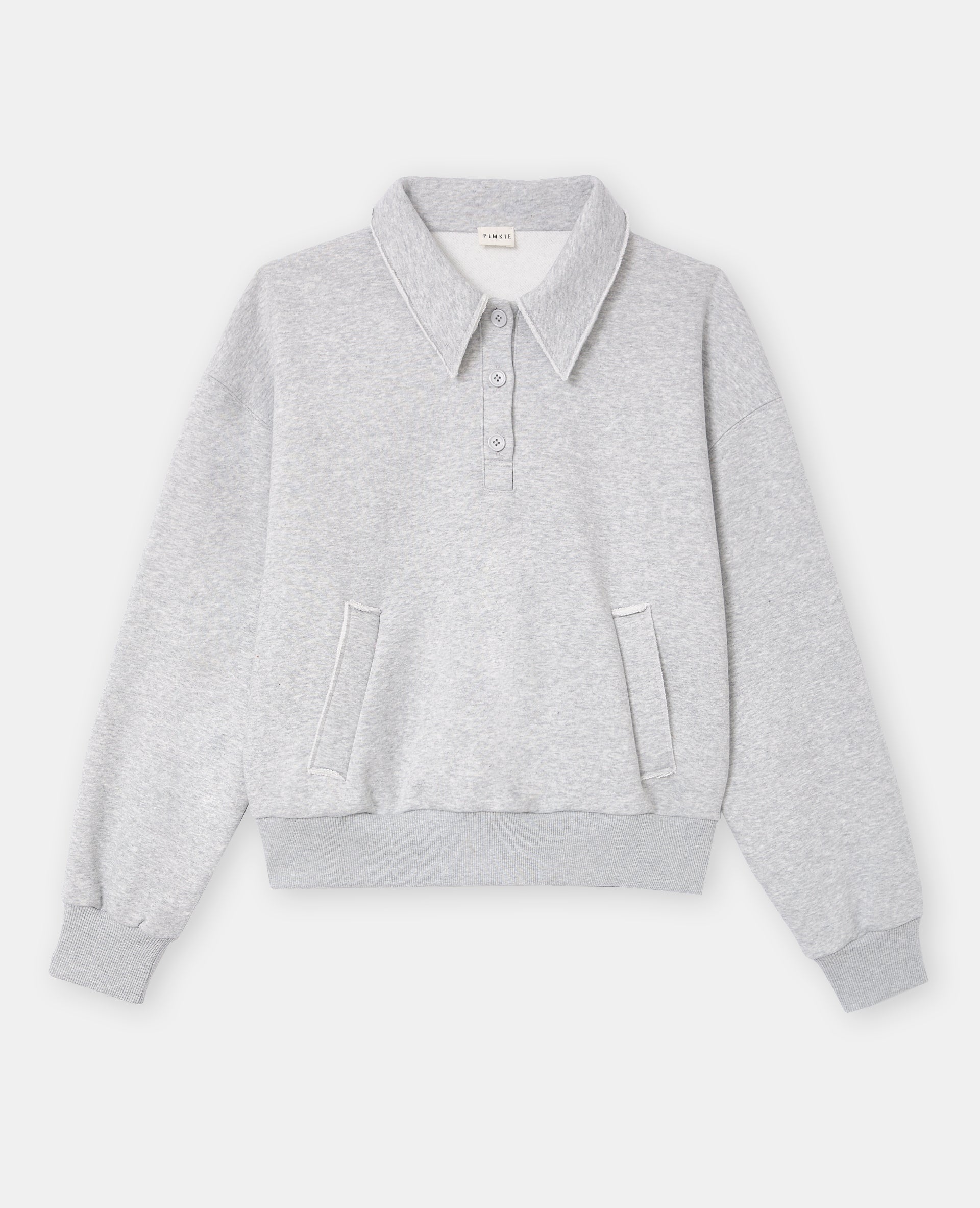 Sweat col polo avec poches et détails coupés