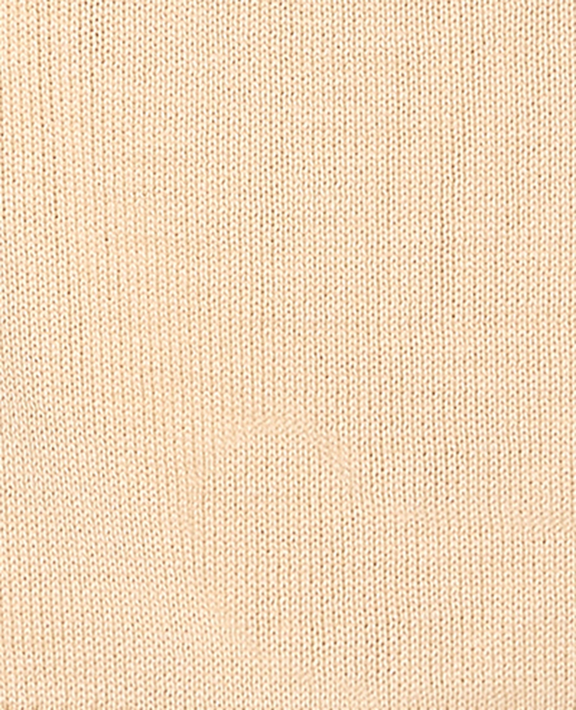 Pull asymétrique avec écriture poitrine