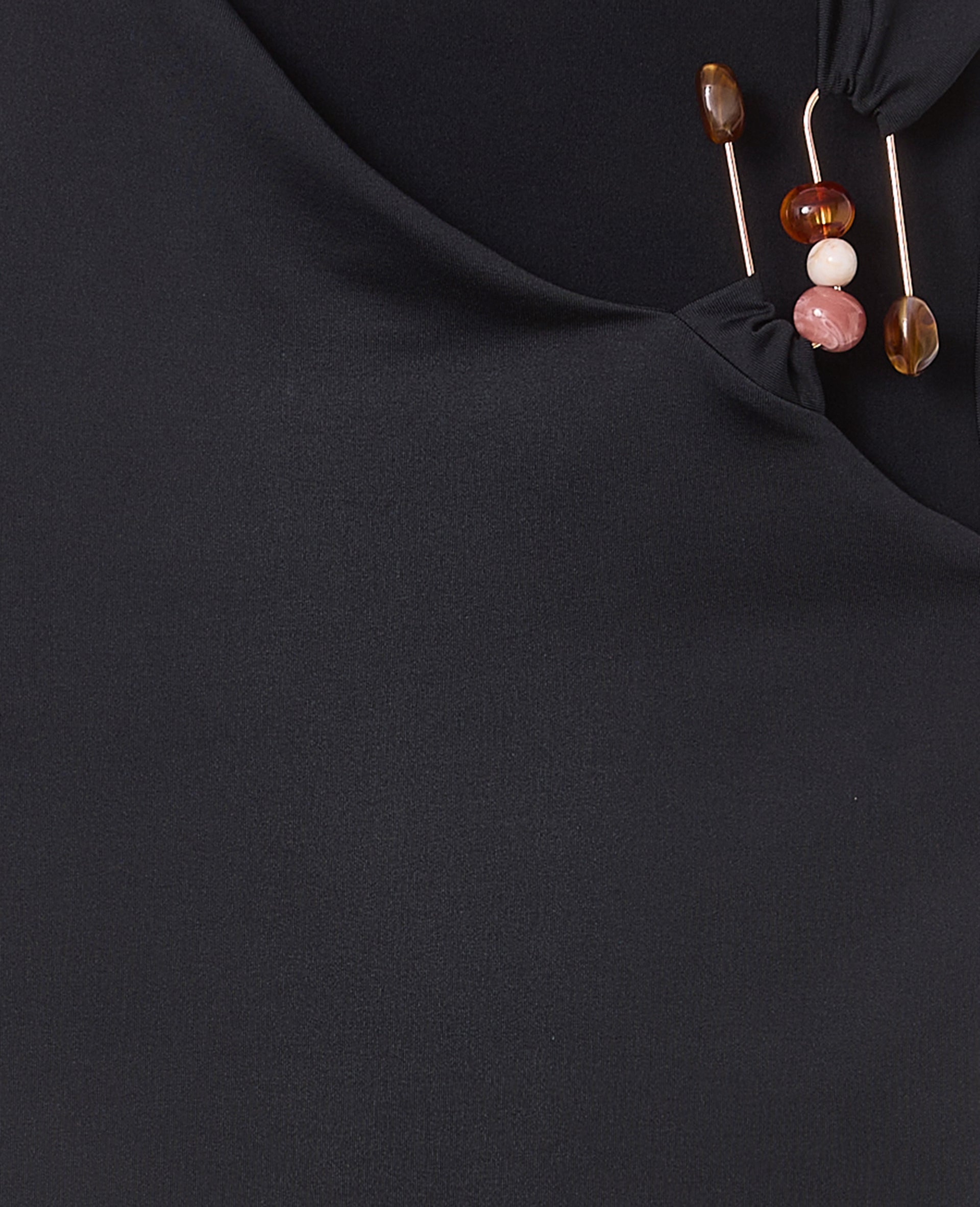 Top asymétrique avec détail bijou et pierres