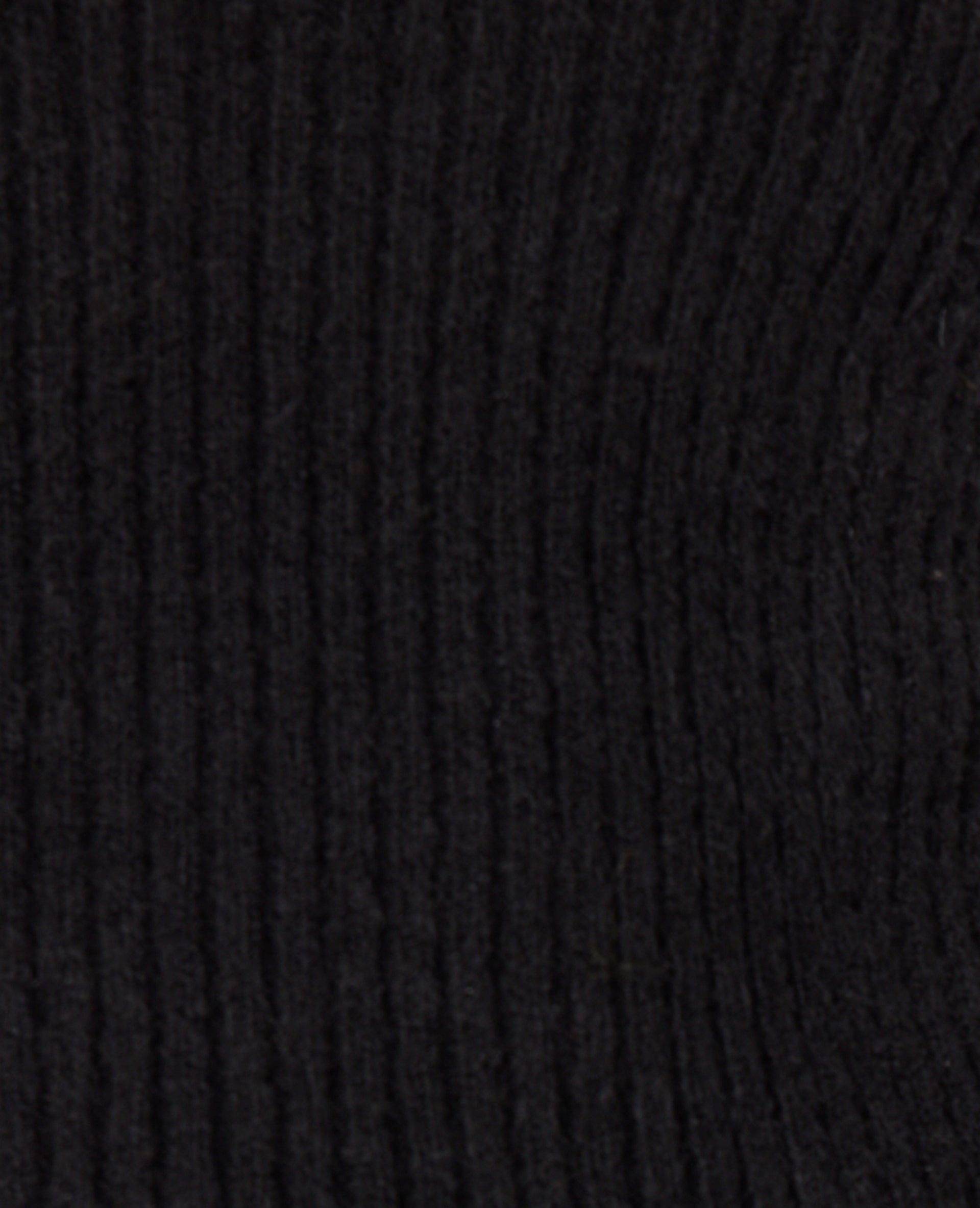 Pull en maille côtelée avec finitions ondulées