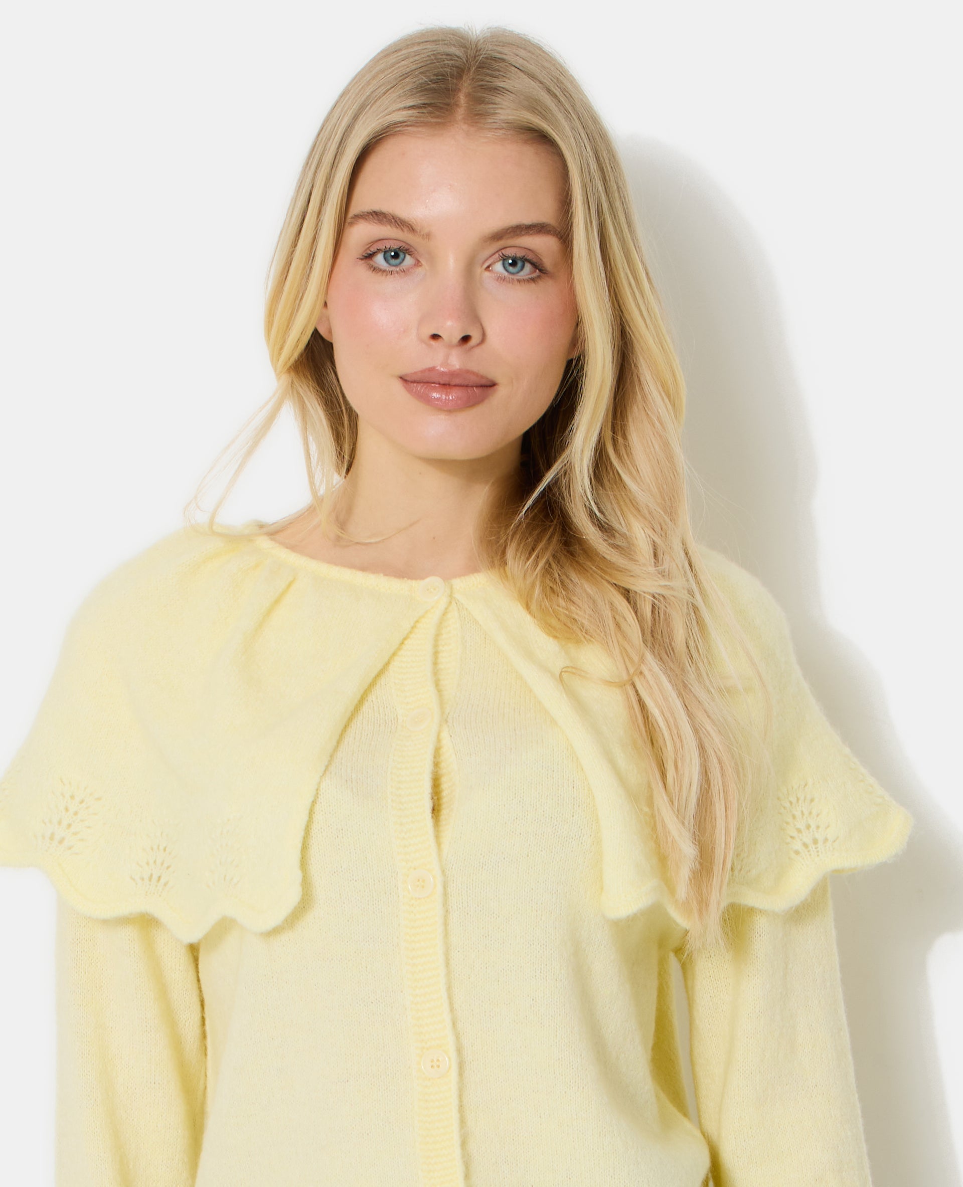 Gilet avec cape en maille ajourée