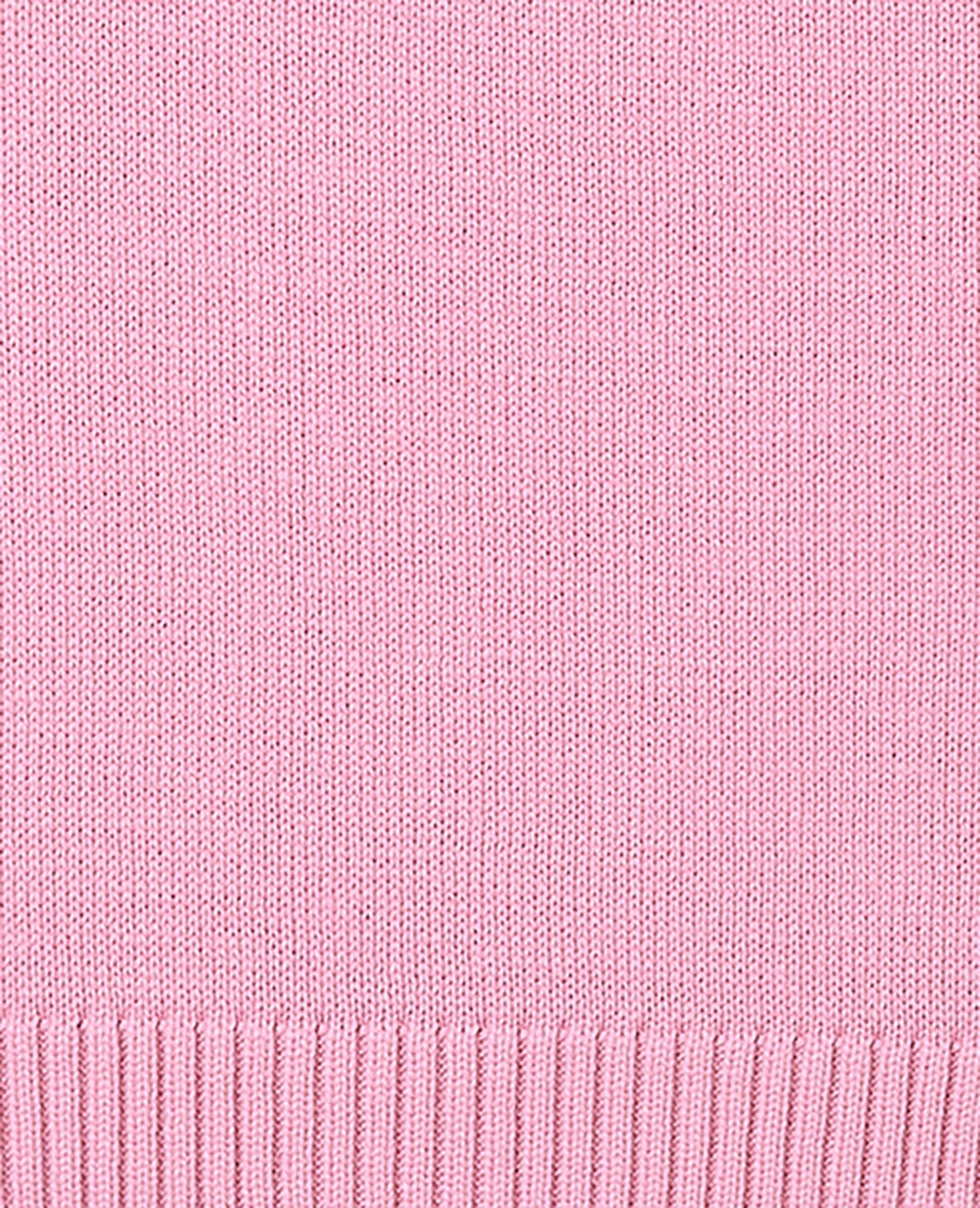 Pull asymétrique avec écriture poitrine