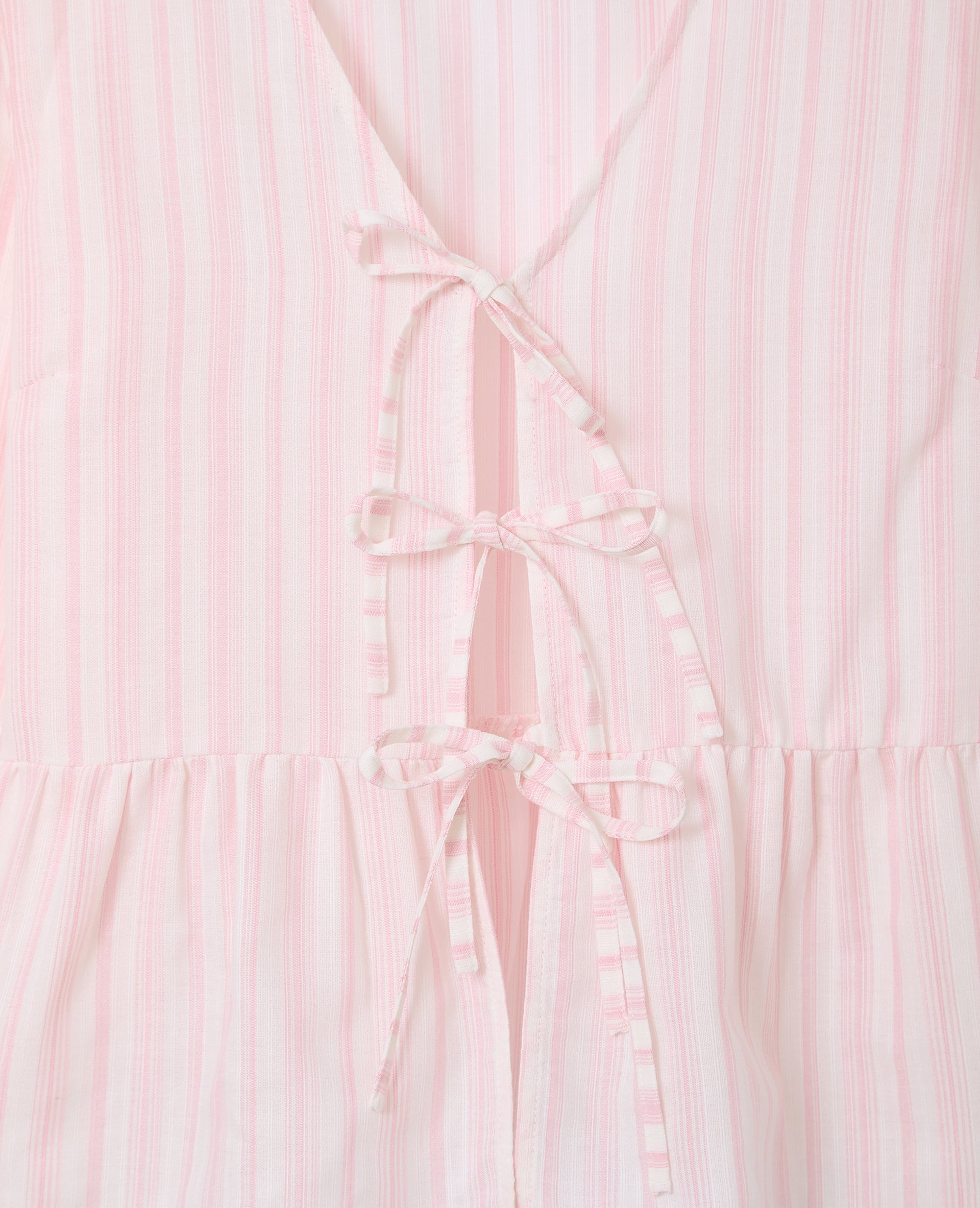 Blouse rayée avec volants et nouettes