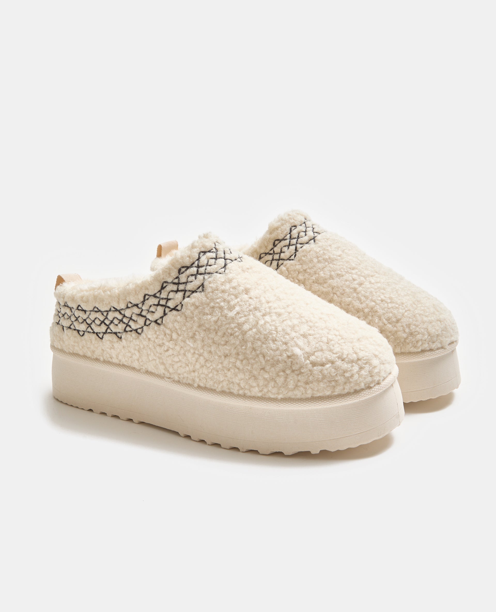 Mules en sherpa avec semelles compensées
